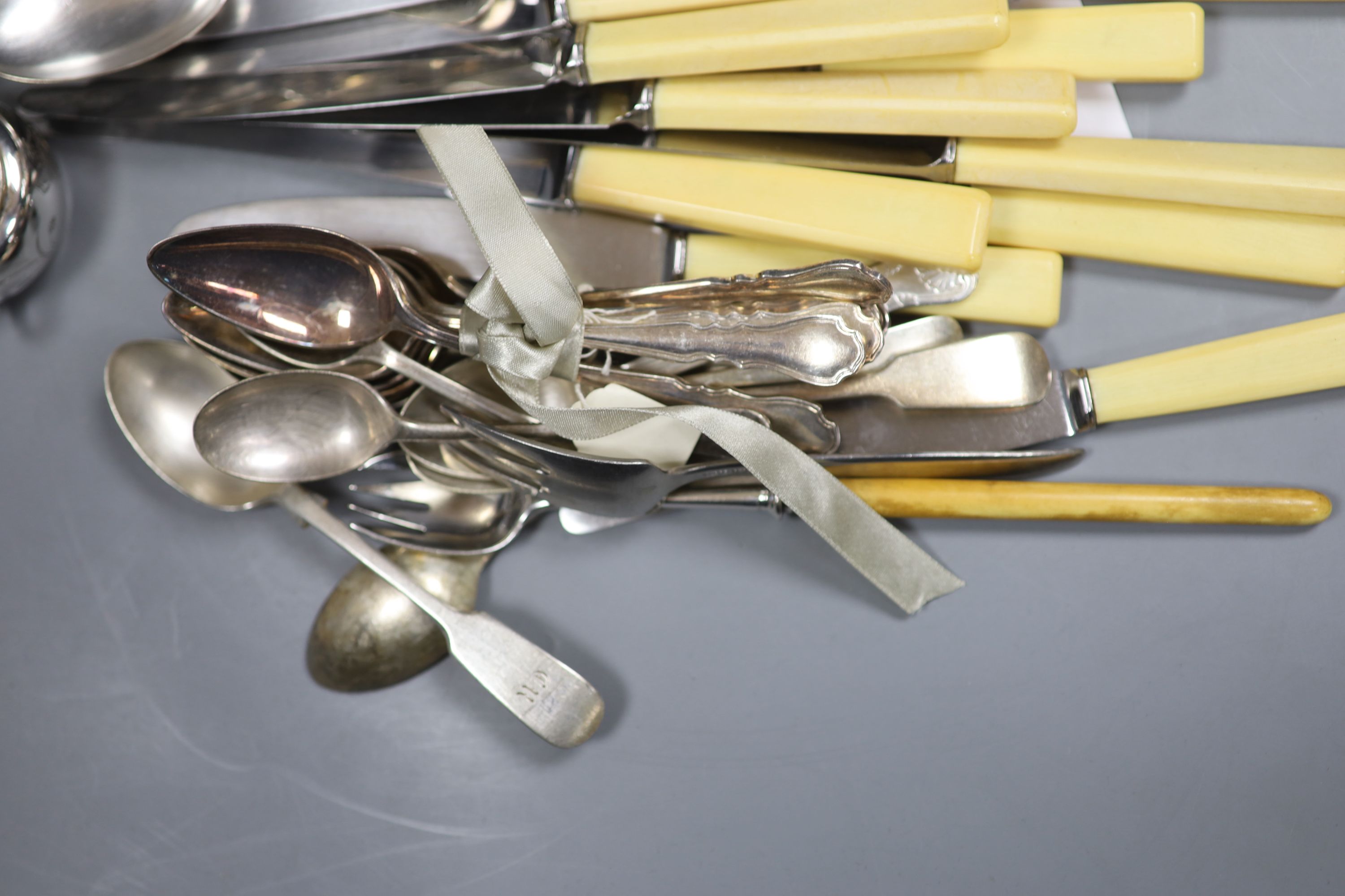 A pair of plated grape scissors, a set of three engraved plated salts, a napkin ring and sundry plated flatware